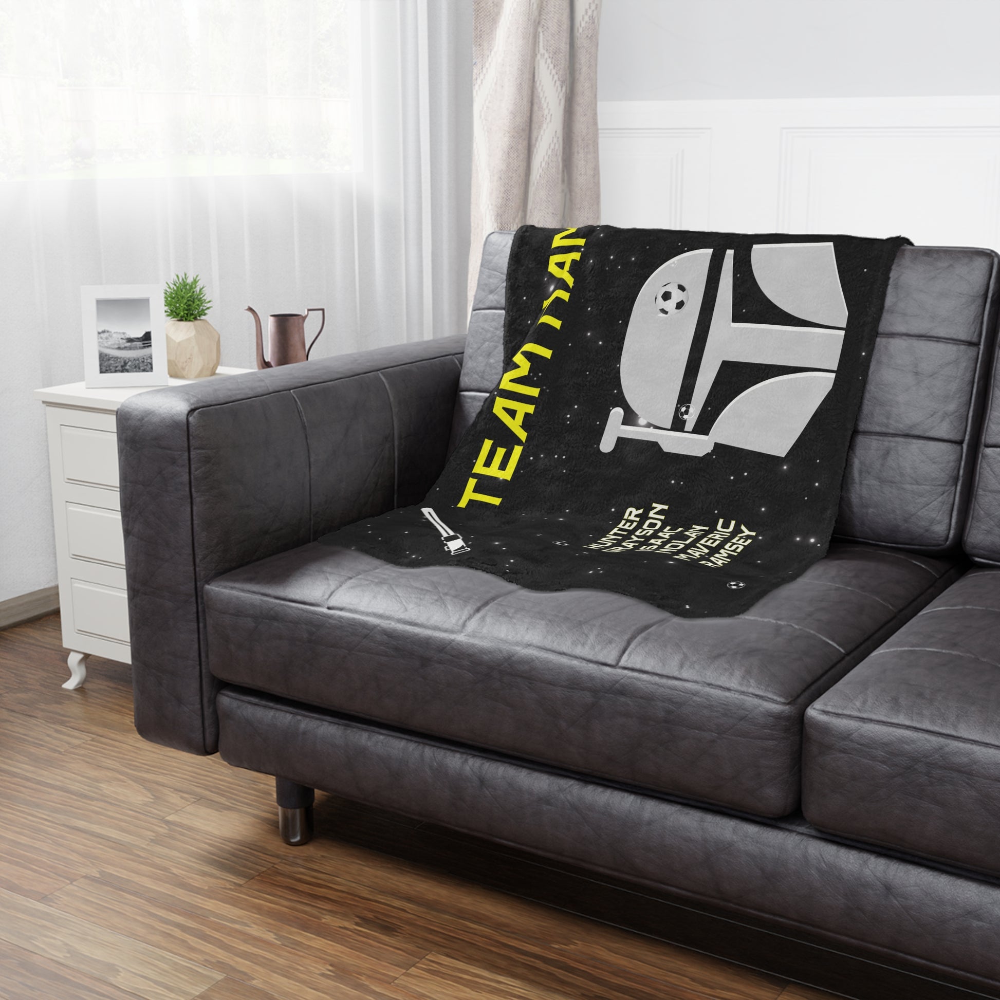  Jedi soccer team banner blanket hanging on side of brown leather couch