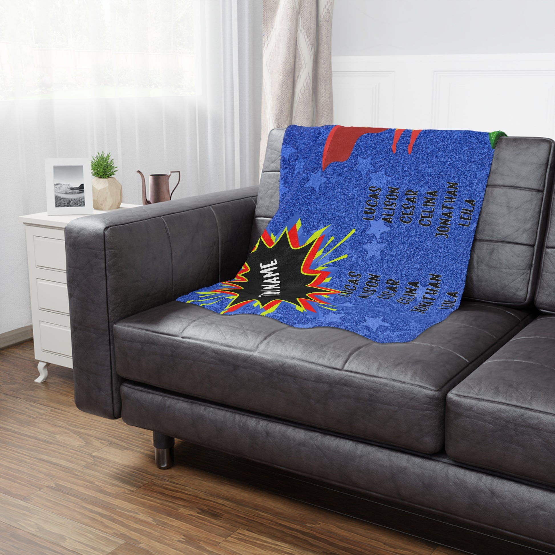 super hero banner blanket draped on brown leather couch